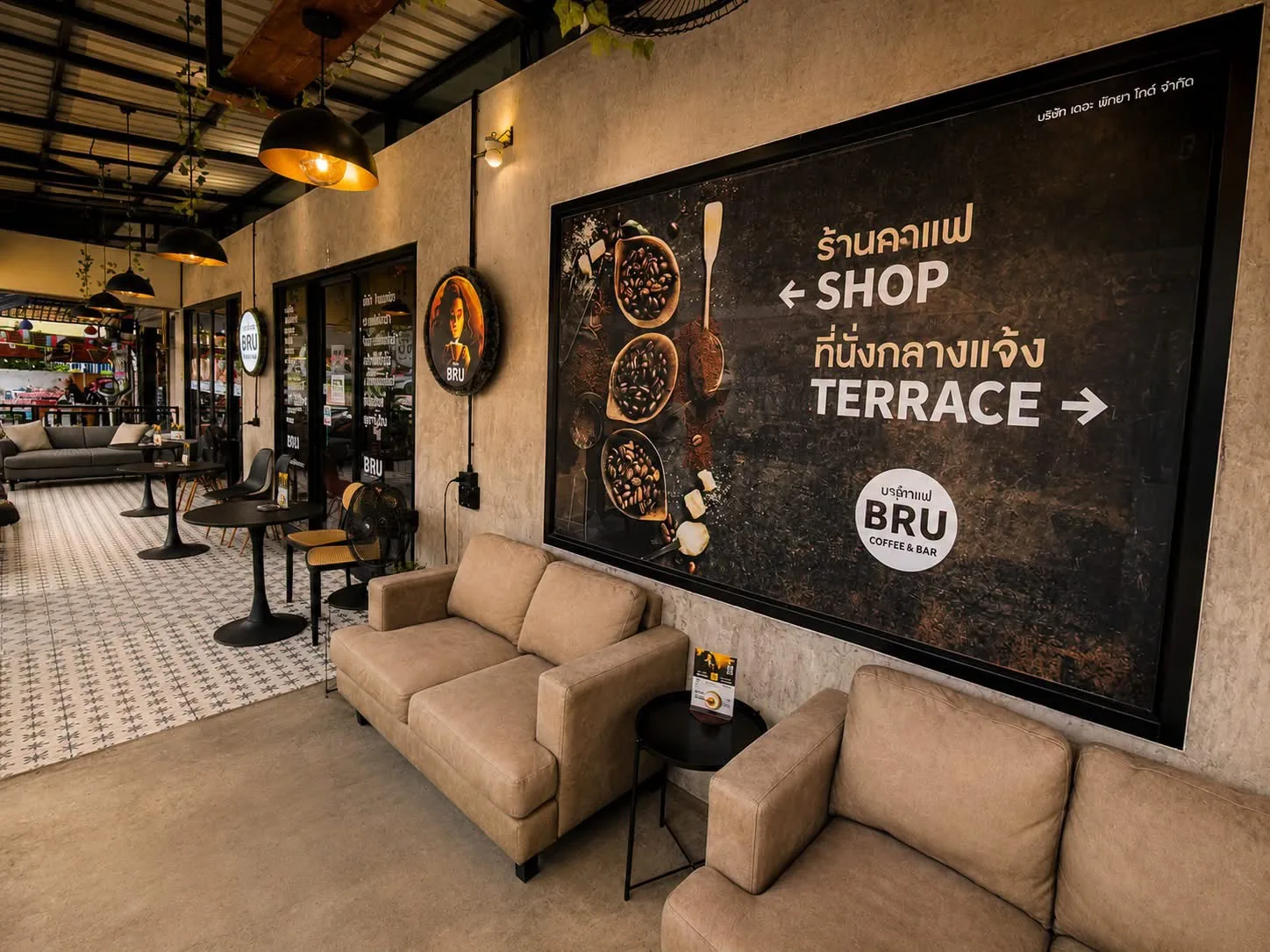 BRU terrace seating with the large exterior sign
